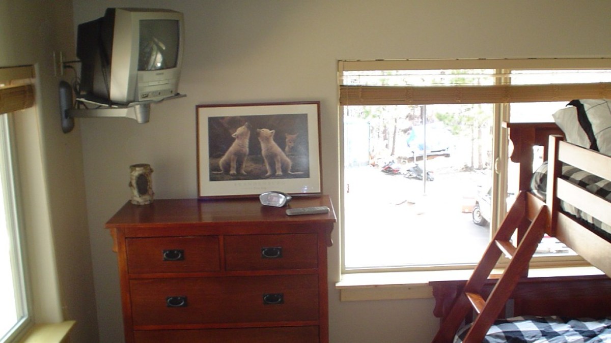 a bedroom with a bed and a mirror