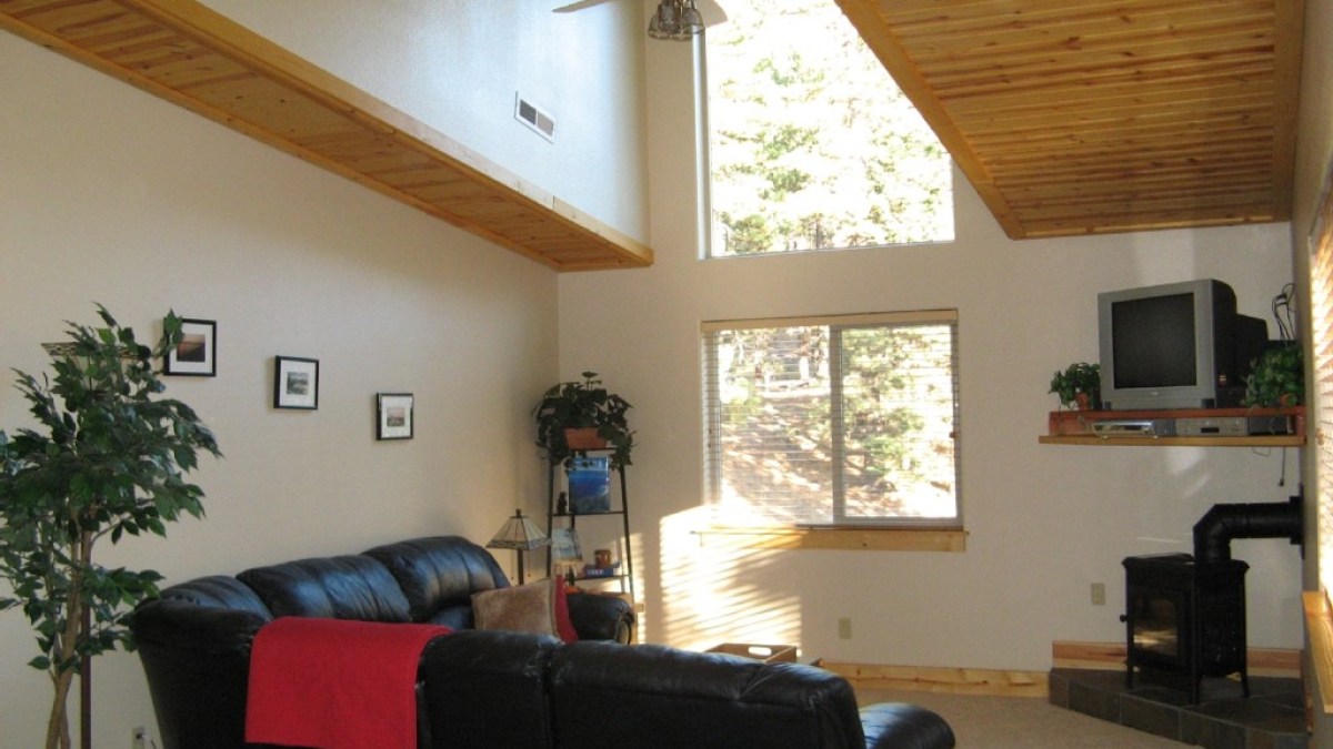 a living room filled with furniture and a large window