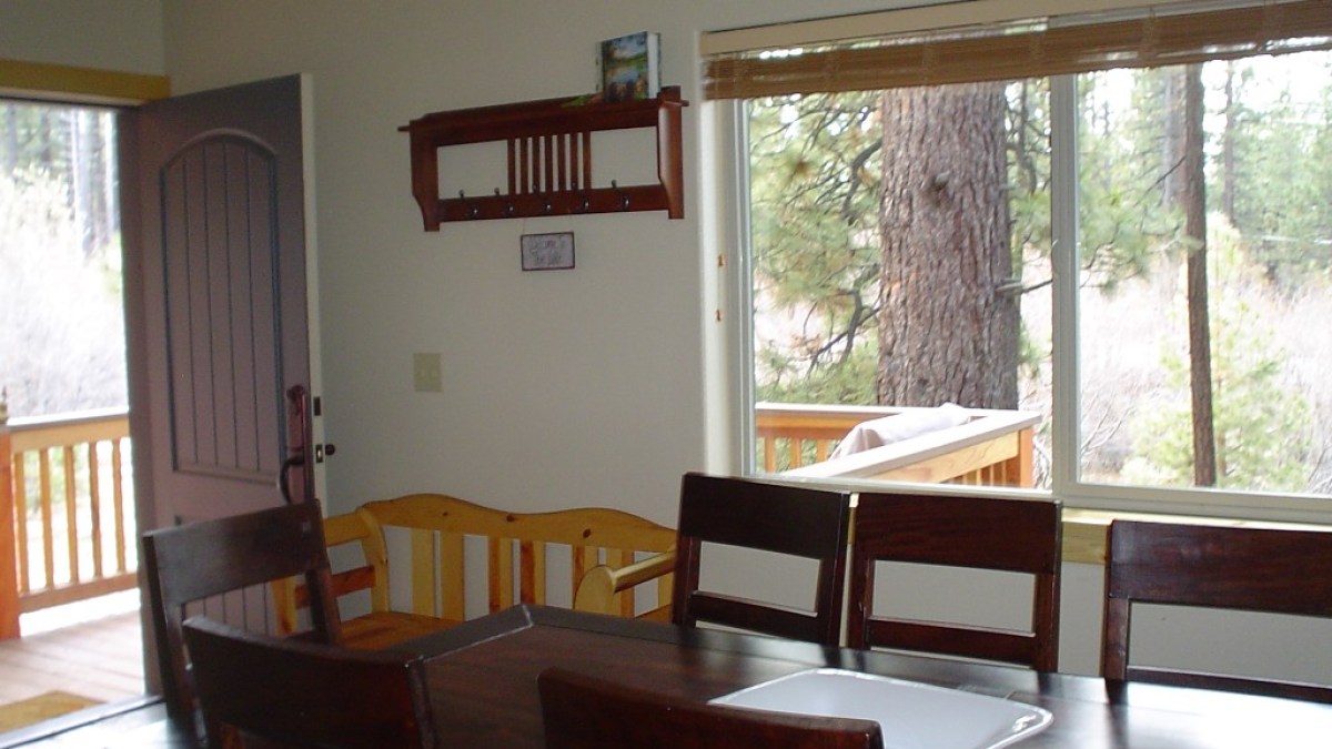 a dining room table in front of a window
