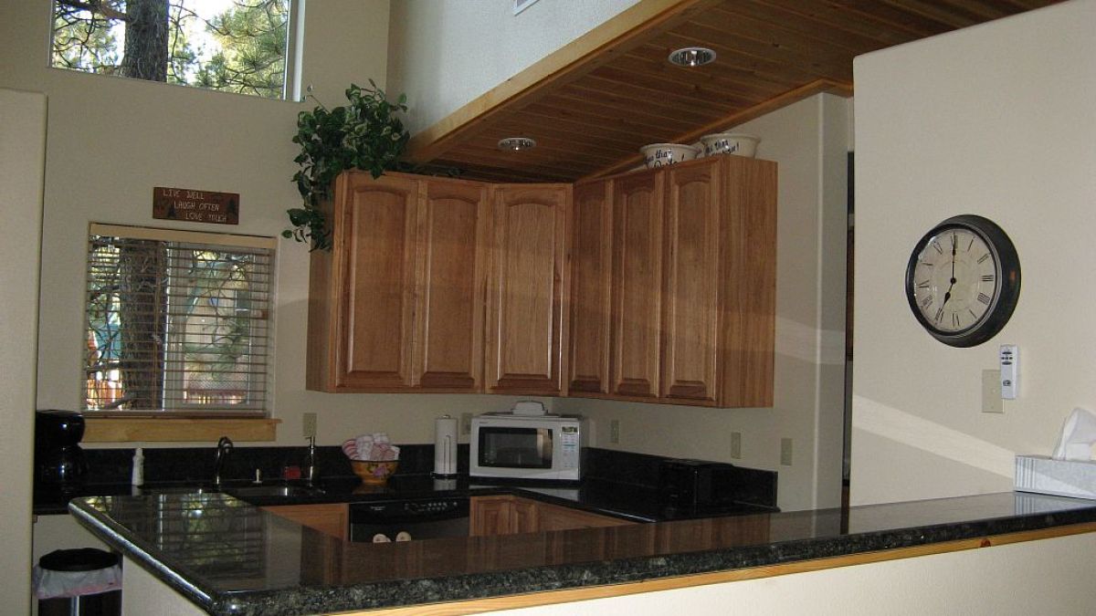a kitchen with a stove and a sink